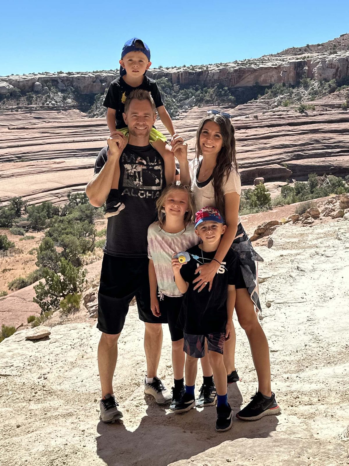 Rich Millar with his wife and three kids on a sandstone hike